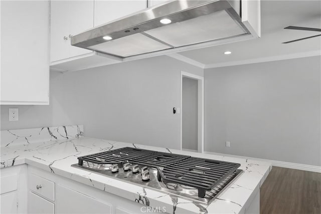 1440 E Abila St, Carson, CA 90745 - kitchen featuring wall chimney range hood, stainless steel gas stovetop, white cabinetry, ornamental molding, and recessed lighting