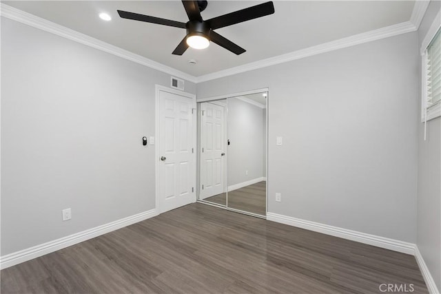 1440 E Abila St, Carson, CA 90745 - unfurnished bedroom with wood finished floors, baseboards, a closet, crown molding, and a ceiling fan