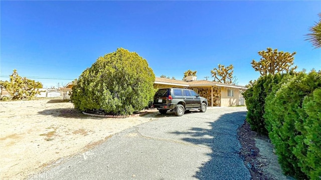 7411 Joshua Ln, Yucca Valley, CA 92284 - view of front of home featuring stone siding