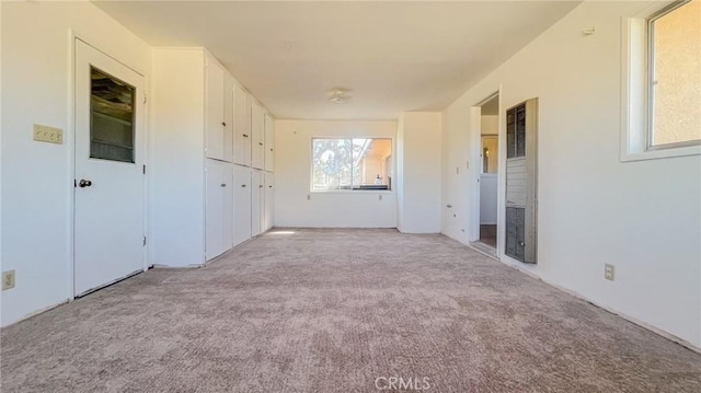 7411 Joshua Ln, Yucca Valley, CA 92284 - unfurnished bedroom with light carpet and a heating unit