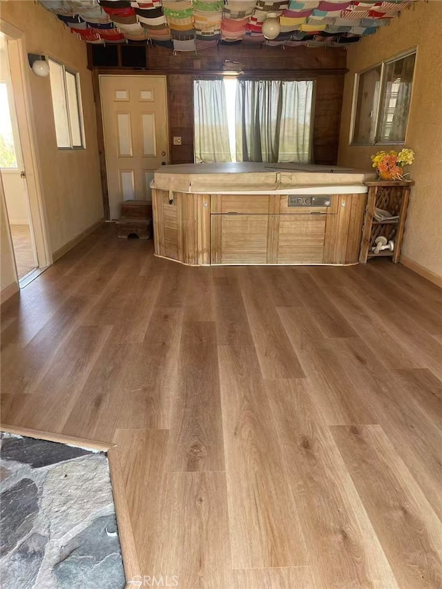 7411 Joshua Ln, Yucca Valley, CA 92284 - kitchen featuring wood finished floors, baseboards, and light countertops