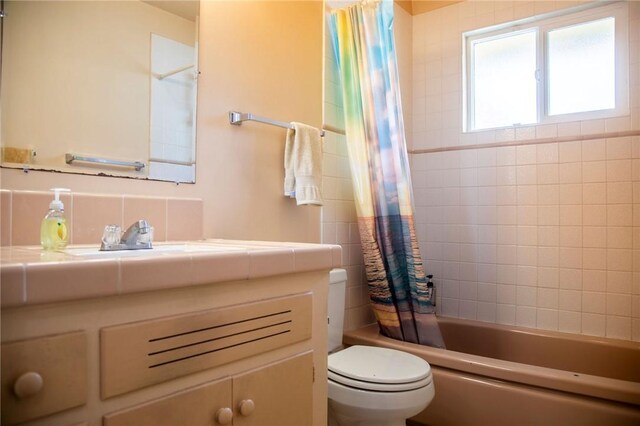 13372 Newhope St, Garden Grove, CA 92843 - full bathroom featuring toilet, vanity, and shower / bath combination with curtain