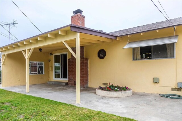 13372 Newhope St, Garden Grove, CA 92843 - rear view of property featuring a chimney, a patio, and stucco siding