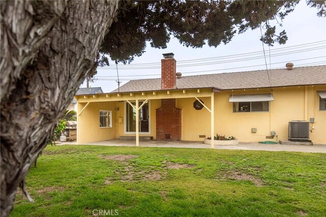 13372 Newhope St, Garden Grove, CA 92843 - rear view of property with cooling unit, stucco siding, a chimney, a yard, and a patio