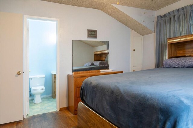 13372 Newhope St, Garden Grove, CA 92843 - bedroom with wood finished floors, vaulted ceiling, and ensuite bathroom