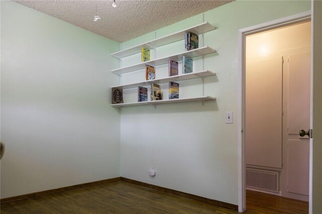 13372 Newhope St, Garden Grove, CA 92843 - empty room featuring wood finished floors, a textured ceiling, and baseboards