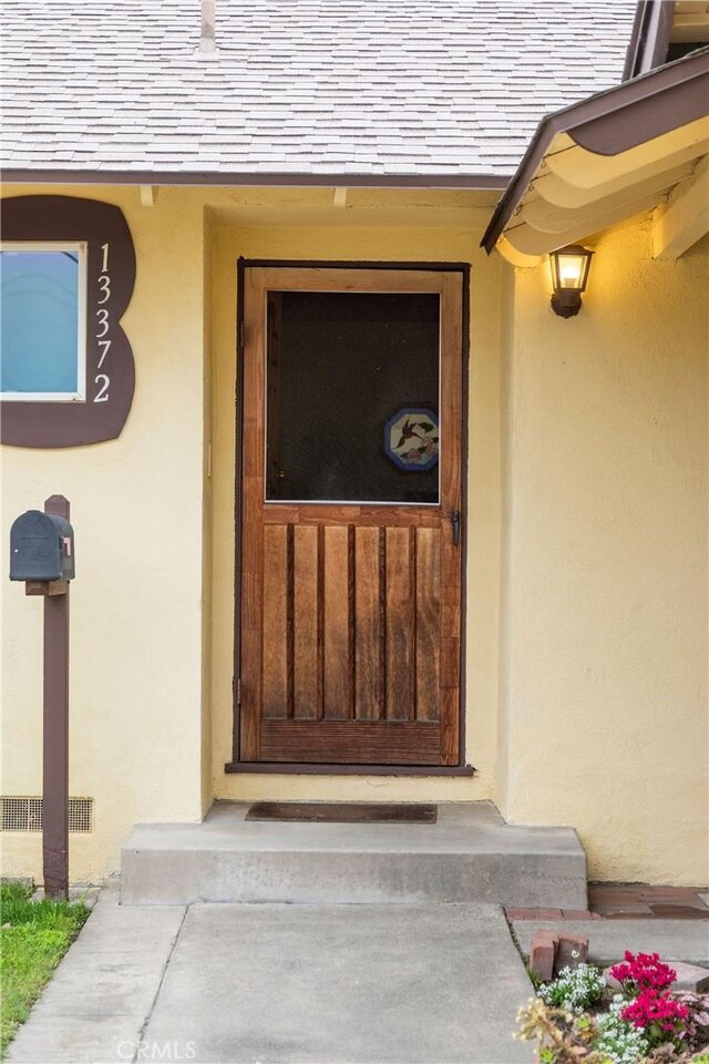 13372 Newhope St, Garden Grove, CA 92843 - doorway to property featuring stucco siding