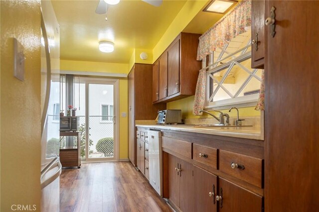 13372 Newhope St, Garden Grove, CA 92843 - kitchen with freestanding refrigerator, light wood-style floors, healthy amount of natural light, and light countertops