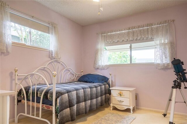13372 Newhope St, Garden Grove, CA 92843 - bedroom with a textured ceiling, light colored carpet, and baseboards