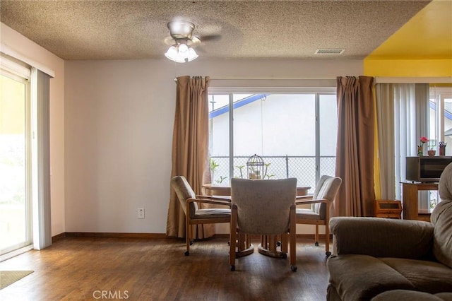 13372 Newhope St, Garden Grove, CA 92843 - dining area with wood finished floors, a textured ceiling, and baseboards