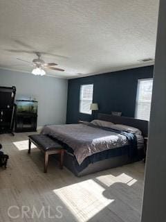 14665 Echo Ln, Helendale, CA 92342 - bedroom with wood finished floors, a textured ceiling, billiards table, and ceiling fan