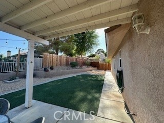 14665 Echo Ln, Helendale, CA 92342 - fenced backyard with a patio