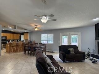 14665 Echo Ln, Helendale, CA 92342 - living area with light tile patterned flooring, ceiling fan, and lofted ceiling