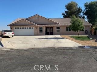 14665 Echo Ln, Helendale, CA 92342 - ranch-style home featuring concrete driveway and an attached garage