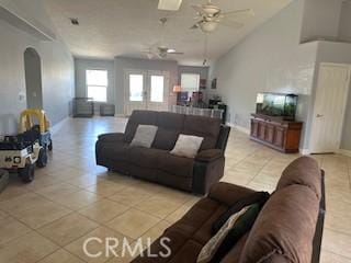 14665 Echo Ln, Helendale, CA 92342 - living area featuring light tile patterned floors, arched walkways, ceiling fan, and lofted ceiling