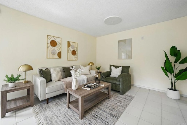 12234 Rancho Bernardo Rd Unit A, Rancho Bernardo San Diego, CA 92128 - living room featuring tile patterned flooring, baseboards, and a textured ceiling