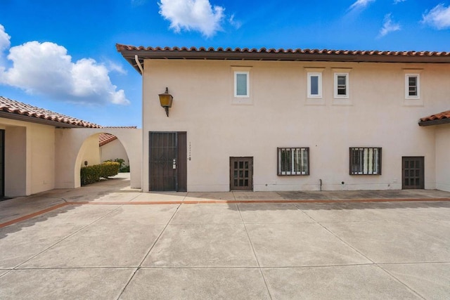 12234 Rancho Bernardo Rd Unit A, Rancho Bernardo San Diego, CA 92128 - back of property with stucco siding and a patio