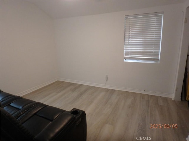 17457 Covello St, Van Nuys, CA 91406 - unfurnished living room with light wood finished floors and baseboards