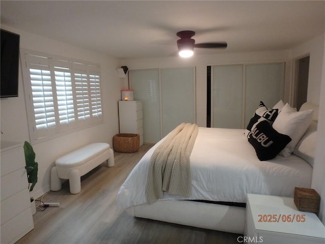 17457 Covello St, Van Nuys, CA 91406 - bedroom with wood finished floors, multiple closets, and a ceiling fan