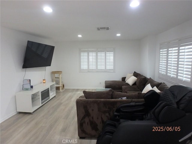 17457 Covello St, Van Nuys, CA 91406 - living room with light wood-style floors, recessed lighting, and baseboards