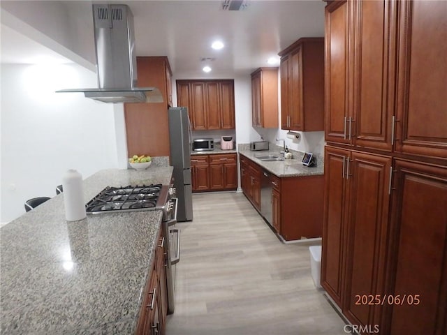 17457 Covello St, Van Nuys, CA 91406 - kitchen with extractor fan, stainless steel appliances, light wood-type flooring, a sink, and light stone counters