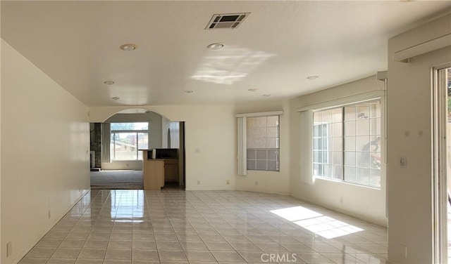 1389 Hillside St, Monterey Park, CA 91754 - unfurnished room featuring arched walkways, recessed lighting, light tile patterned flooring, and baseboards