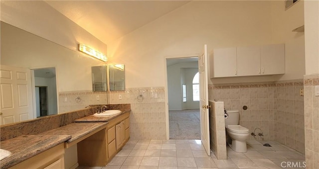 1389 Hillside St, Monterey Park, CA 91754 - bathroom with tile walls, tile patterned floors, vanity, toilet, and a wainscoted wall