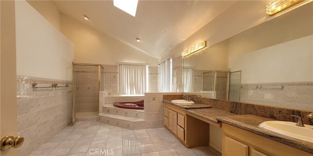 1389 Hillside St, Monterey Park, CA 91754 - bathroom with tile walls, tile patterned flooring, a tile shower, a bath, and double vanity