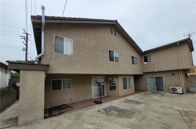 1389 Hillside St, Monterey Park, CA 91754 - rear view of house with stucco siding, a cooling unit, and a patio area