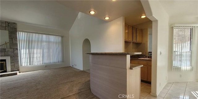 1389 Hillside St, Monterey Park, CA 91754 - kitchen with vaulted ceiling, plenty of natural light, light tile patterned floors, and a sink