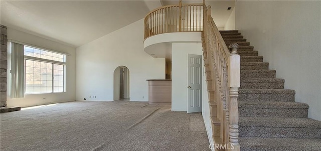 1389 Hillside St, Monterey Park, CA 91754 - stairway with high vaulted ceiling, arched walkways, and carpet flooring