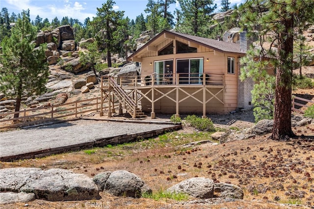 39335 Lark Rd, Big Bear Lake, CA 92315 - view of front of house with a chimney and a deck