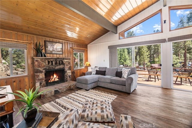 39335 Lark Rd, Big Bear Lake, CA 92315 - living room featuring a fireplace, plenty of natural light, wood finished floors, wooden walls, and wooden ceiling with exposed beams
