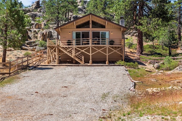 39335 Lark Rd, Big Bear Lake, CA 92315 - view of front of home featuring a chimney and stairs