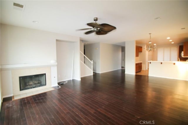 29113 Peppergrass Ave, Menifee, CA 92584 - unfurnished living room with a fireplace with flush hearth, wood-type flooring, ceiling fan, a chandelier, and recessed lighting