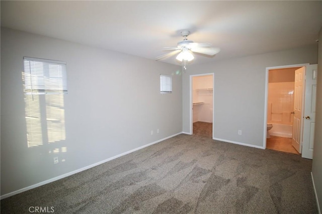 29113 Peppergrass Ave, Menifee, CA 92584 - unfurnished bedroom with carpet, a walk in closet, baseboards, a closet, and a ceiling fan