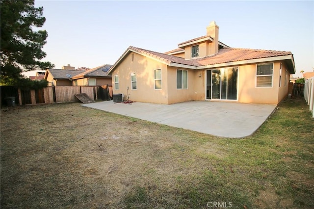29113 Peppergrass Ave, Menifee, CA 92584 - back of house with stucco siding, a tile roof, central AC unit, a patio, and a chimney