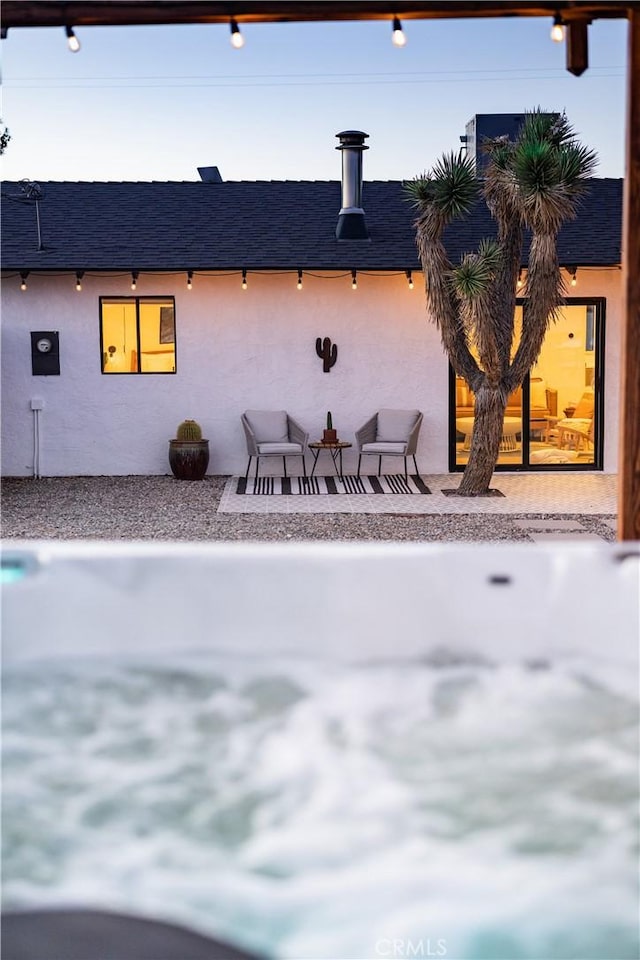 63326 Sunny Sands Dr, Joshua Tree, CA 92252 - back of property featuring stucco siding and a shingled roof
