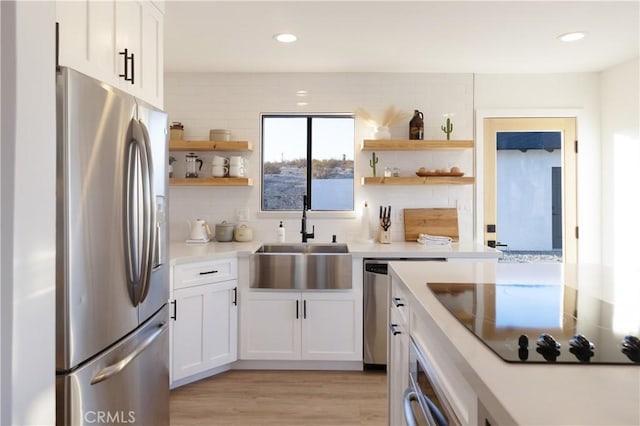 63326 Sunny Sands Dr, Joshua Tree, CA 92252 - kitchen with stainless steel refrigerator with ice dispenser, open shelves, a sink, black electric cooktop, and recessed lighting
