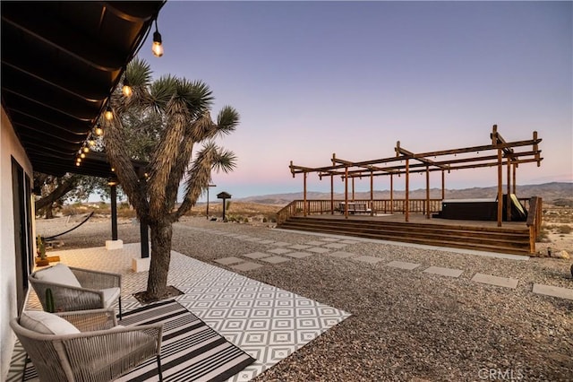 63326 Sunny Sands Dr, Joshua Tree, CA 92252 - yard at dusk featuring a pergola and a patio area