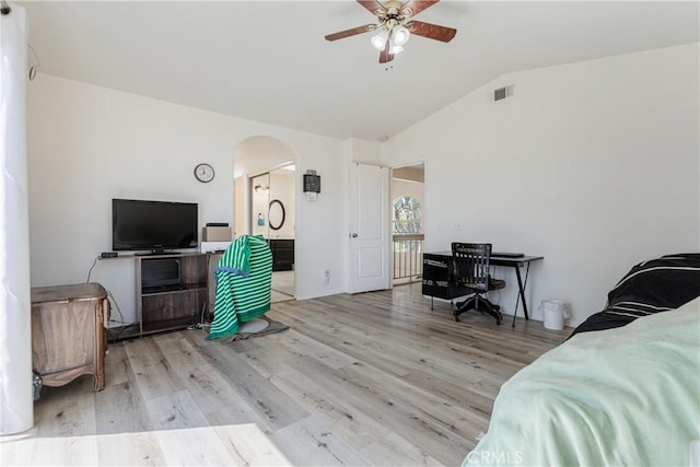 25213 Via Las Lomas, Murrieta, CA 92562 - bedroom featuring arched walkways, vaulted ceiling, wood finished floors, and a ceiling fan