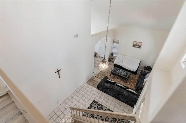25213 Via Las Lomas, Murrieta, CA 92562 - staircase with arched walkways, wood finished floors, and vaulted ceiling