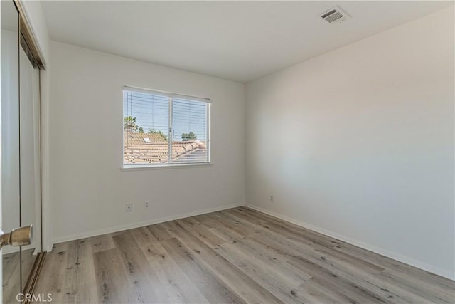 25213 Via Las Lomas, Murrieta, CA 92562 - unfurnished bedroom with light wood-style floors and a closet