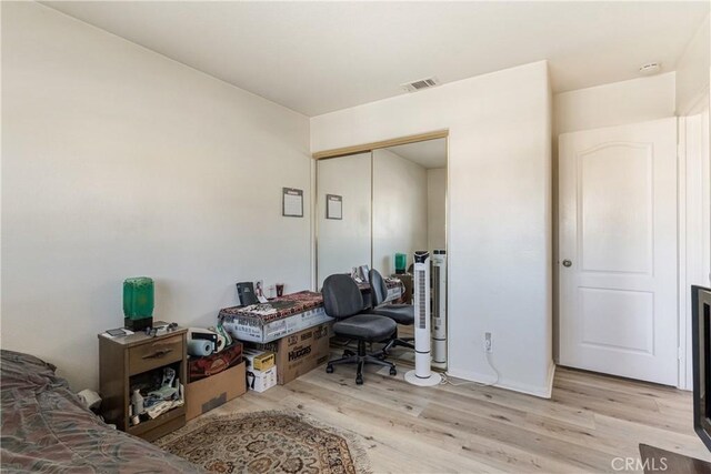 25213 Via Las Lomas, Murrieta, CA 92562 - bedroom with light wood finished floors and a closet
