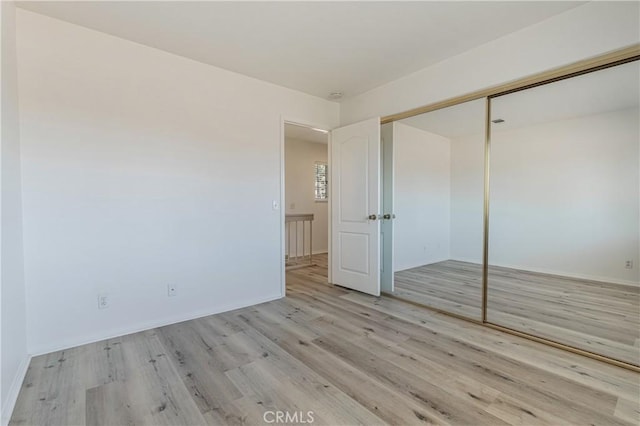 25213 Via Las Lomas, Murrieta, CA 92562 - unfurnished bedroom with wood finished floors and a closet