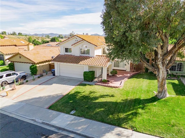 25213 Via Las Lomas, Murrieta, CA 92562 - view of front of property featuring concrete driveway, stucco siding, a tile roof, a garage, and a front lawn