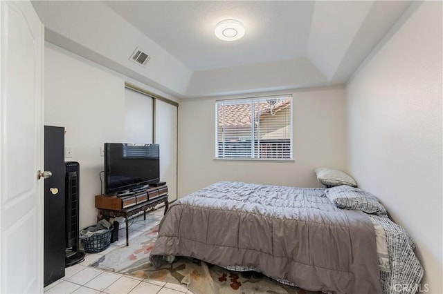 25213 Via Las Lomas, Murrieta, CA 92562 - bedroom featuring light tile patterned flooring, a closet, and a tray ceiling