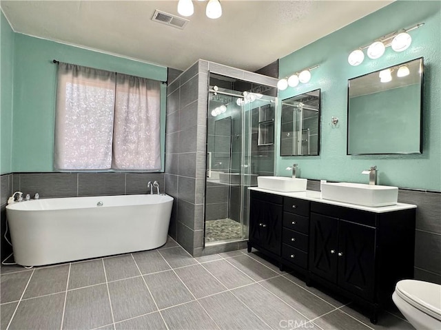 8 Geneva Ln, Chico, CA 95926 - full bath with a stall shower, double vanity, a freestanding bath, tile patterned floors, and toilet