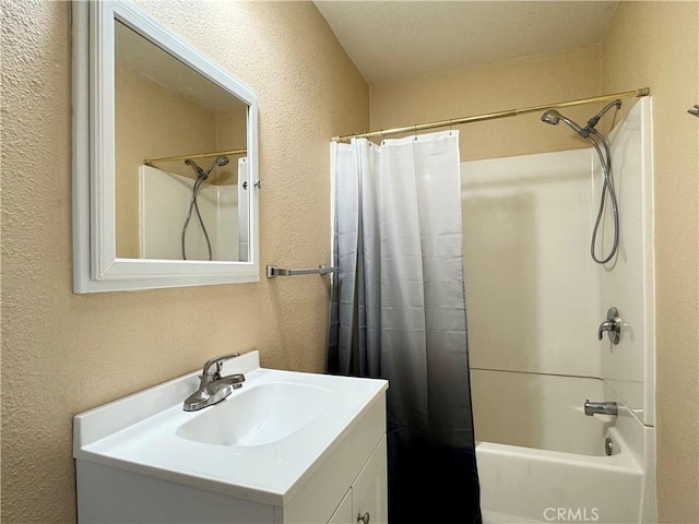 8 Geneva Ln, Chico, CA 95926 - full bathroom with a textured wall, vanity, and shower / bath combination with curtain