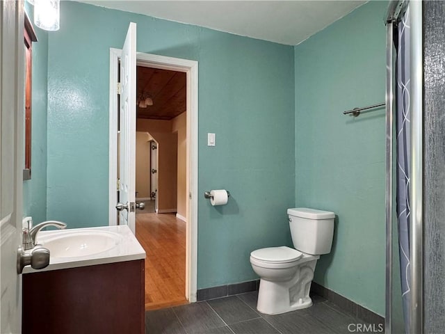8 Geneva Ln, Chico, CA 95926 - bathroom with vanity, toilet, baseboards, and wooden ceiling